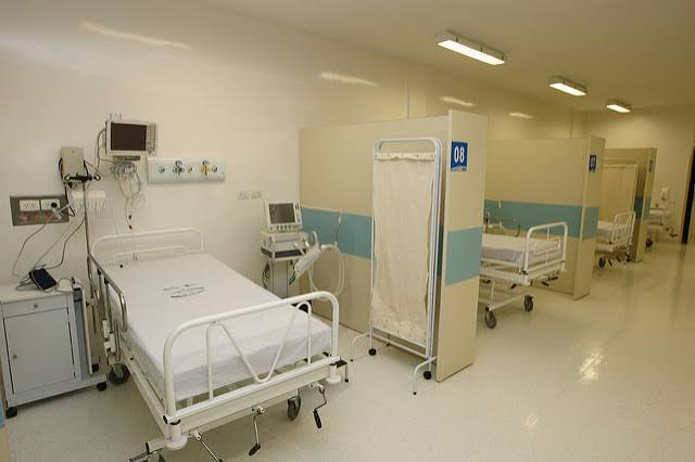 Modern hospital room with patient beds and advanced medical equipment for hospital services.